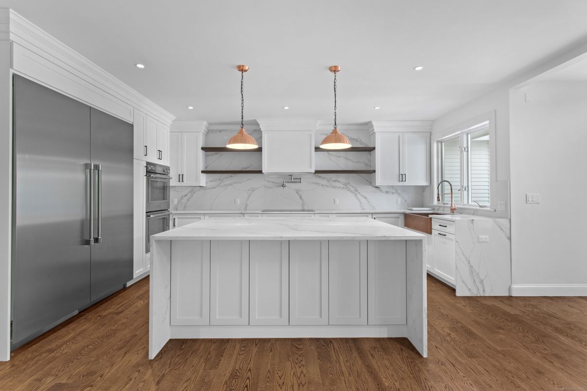 Interior, Kitchen, Marble Walls, Pendant Lights, Recessed Lighting, Stainless Steel Appliances, Wood Texture Flooring