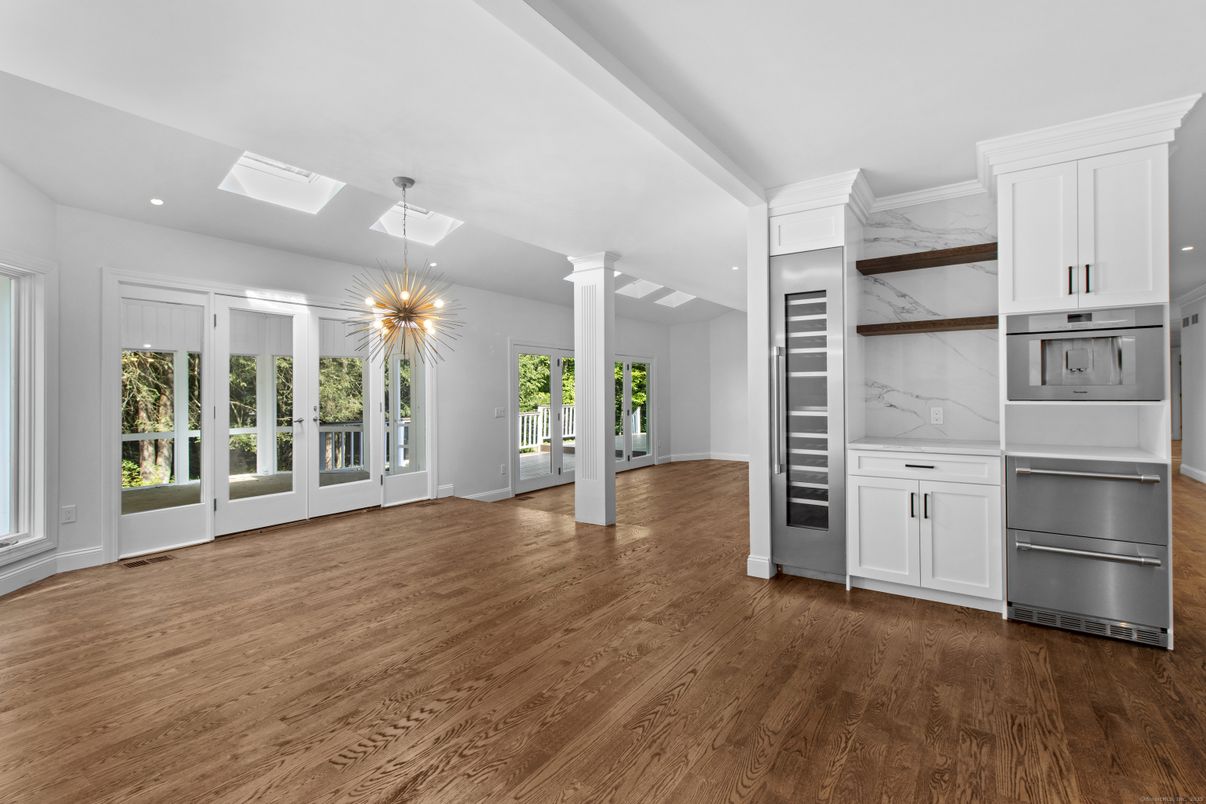Interior, Kitchen, Marble Walls, Pendant Lights, Recessed Lighting, Stainless Steel Appliances, Wood Texture Flooring