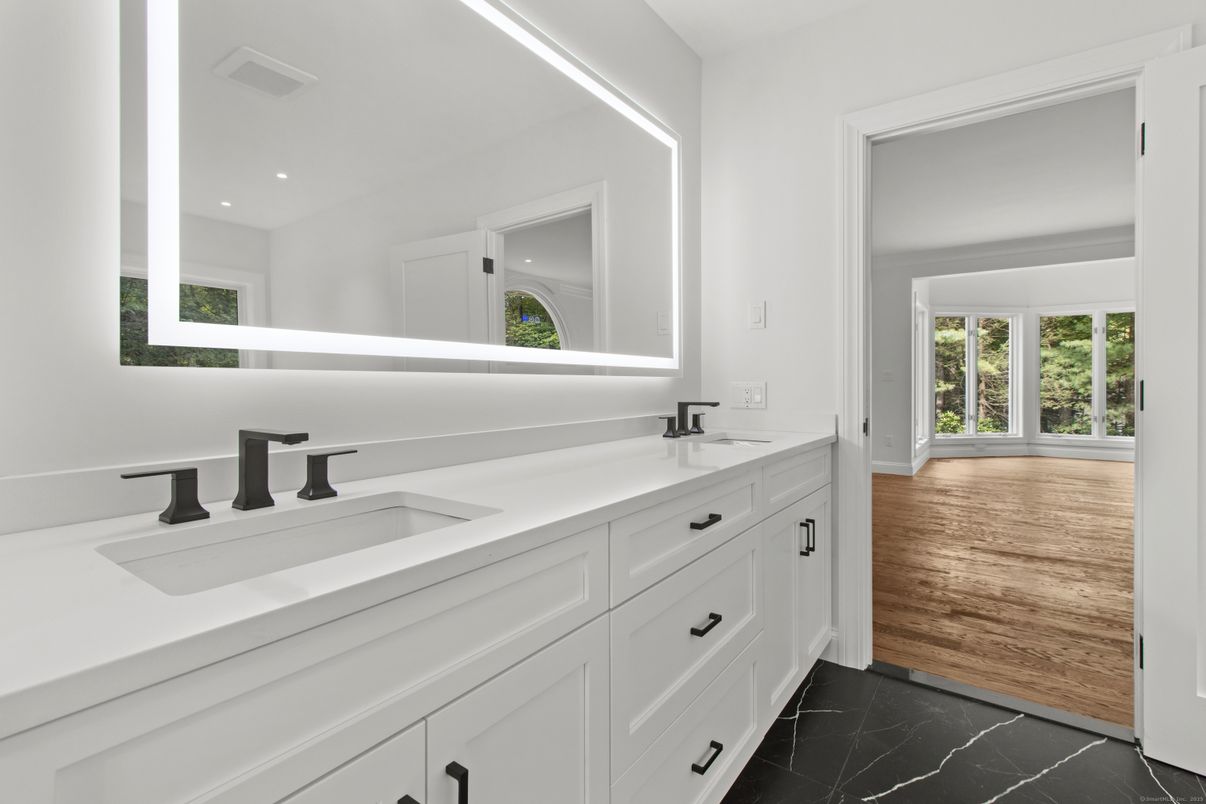 Bathroom, Dual Sink Vanities, Interior, Marble, Recessed Lighting, Wood Texture Flooring