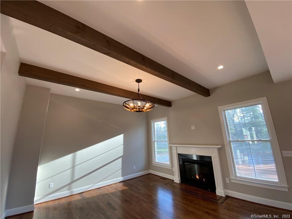 Empty room, Fireplace, Interior, Pendant Lights, Recessed Lighting, Wooden Beams, Wood Texture Flooring