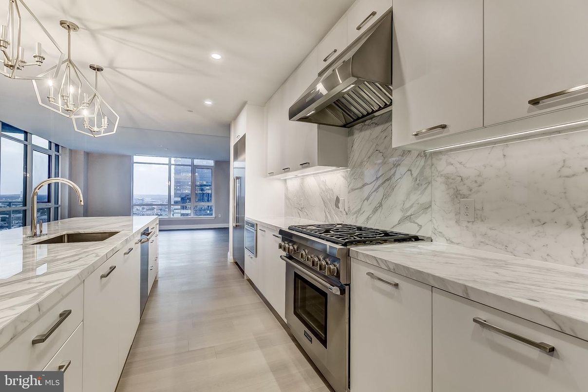 Chandelier, Interior, Kitchen, Marble Walls, Recessed Lighting, Stainless Steel Appliances, Wood Texture Flooring