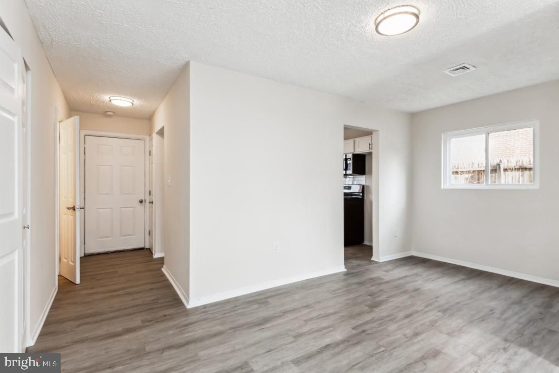Empty room, Interior, Kitchen, Stainless Steel Appliances, Wood Texture Flooring