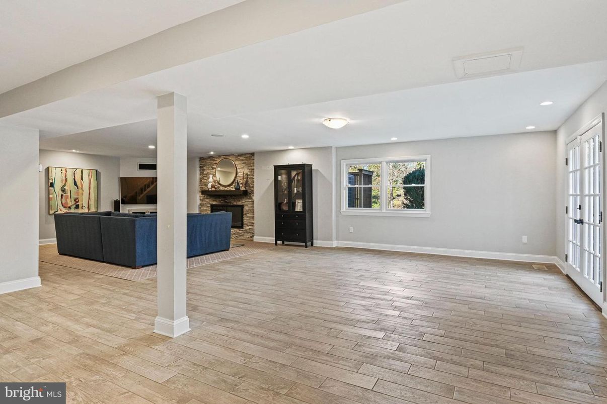 Fireplace, Interior, Living room, Recessed Lighting, Stone Walls, Wood Texture Flooring