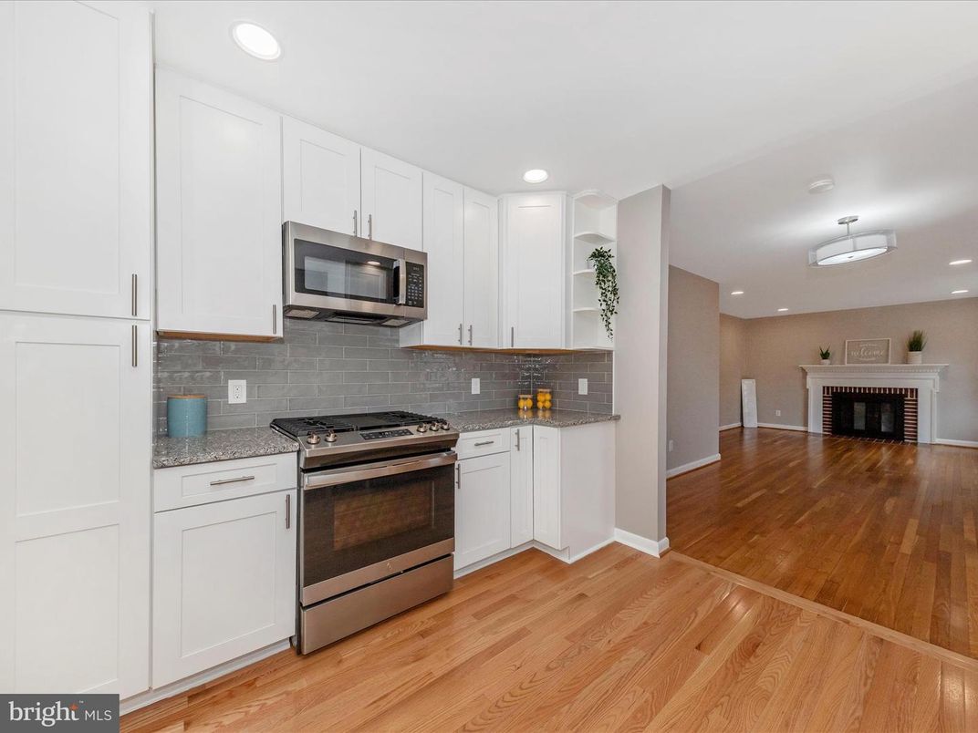 Fireplace, Interior, Kitchen, Recessed Lighting, Stainless Steel Appliances, Wood Texture Flooring