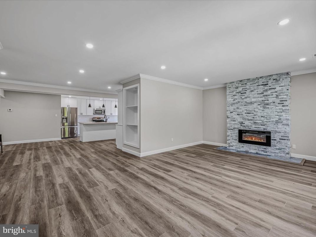 Empty room, Fireplace, Interior, Kitchen, Recessed Lighting, Wood Texture Flooring