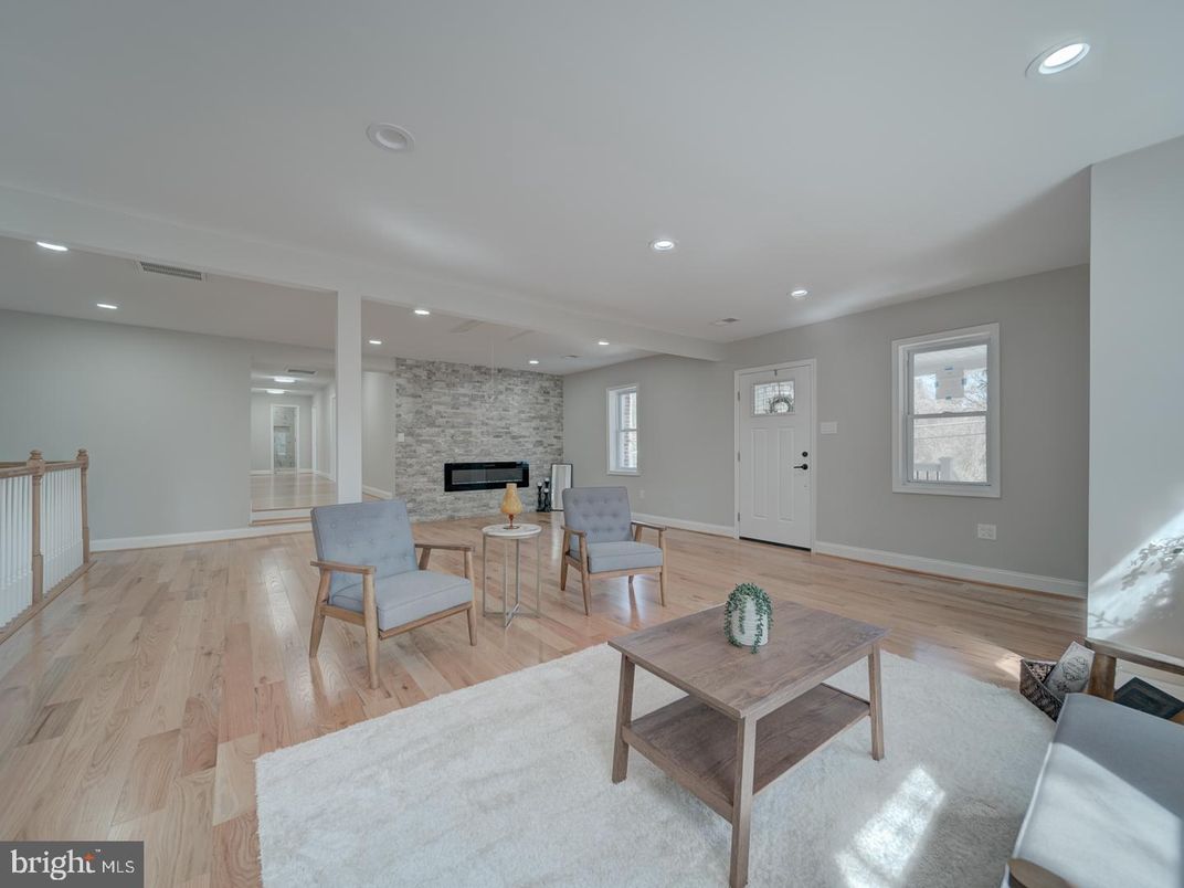 Fireplace, Interior, Living room, Recessed Lighting, Stone Walls, Wood Texture Flooring