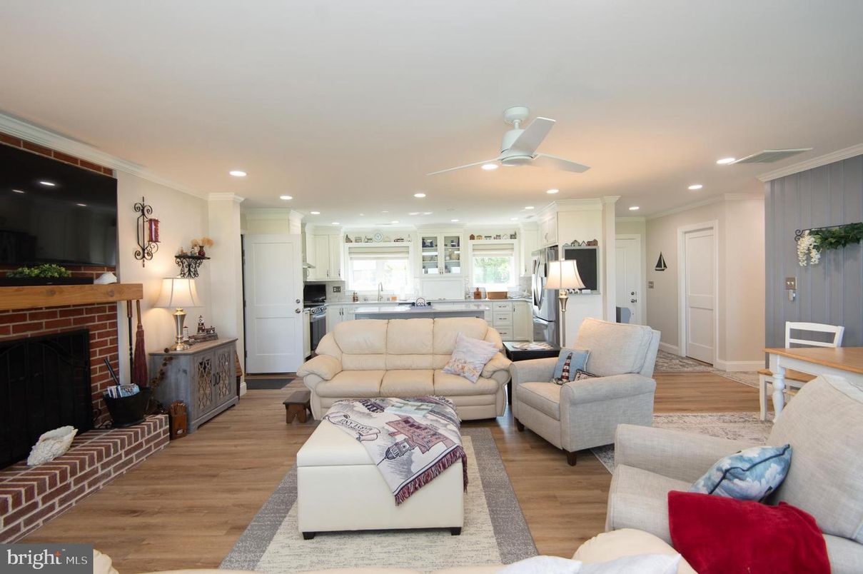 Fireplace, Interior, Kitchen, Living room, Recessed Lighting, Stainless Steel Appliances, Wood Texture Flooring