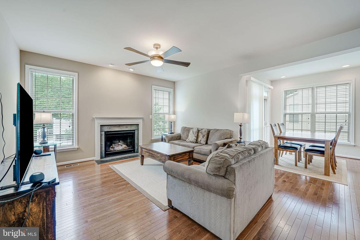 Dining room, Fireplace, Interior, Living room, Recessed Lighting, Wood Texture Flooring
