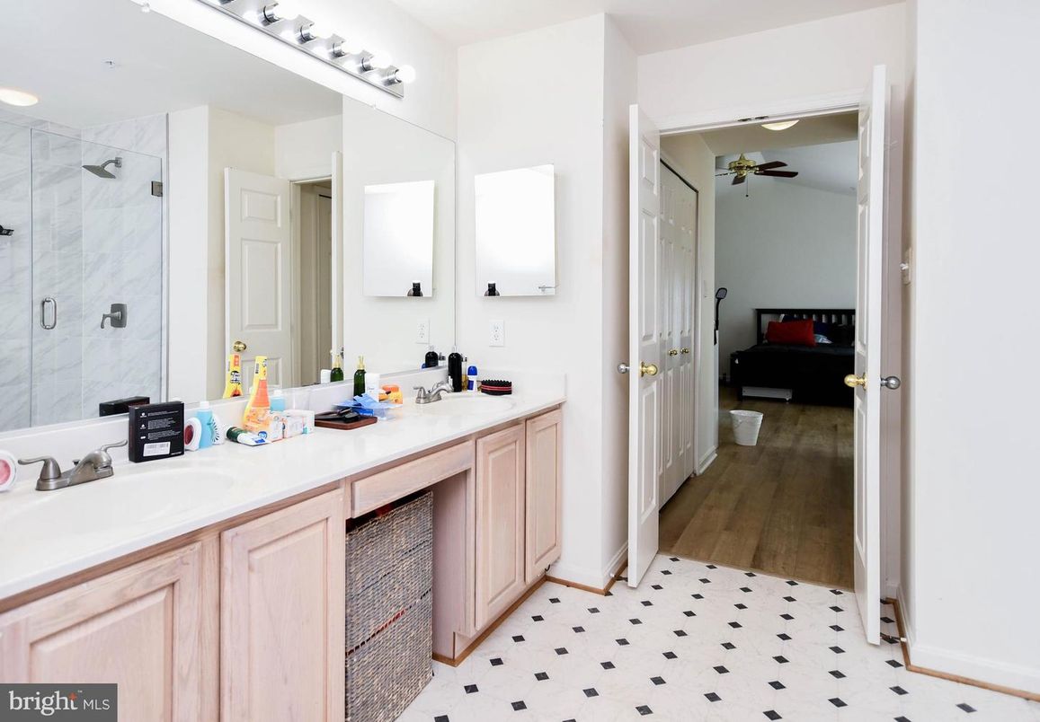 Bathroom, Bedroom, Dual Sink Vanities, Glass Shower, Interior, Marble Walls, Recessed Lighting, Wood Texture Flooring
