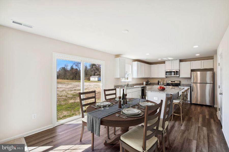 Dining room, Interior, Kitchen, Recessed Lighting, Stainless Steel Appliances, Wood Texture Flooring