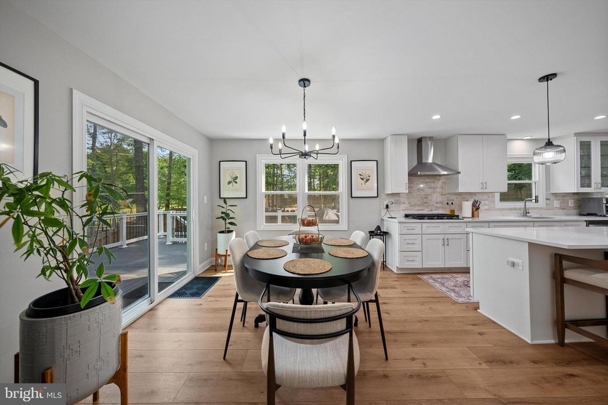 Chandelier, Dining room, Interior, Kitchen, Pendant Lights, Recessed Lighting, Stainless Steel Appliances, Wood Texture Flooring