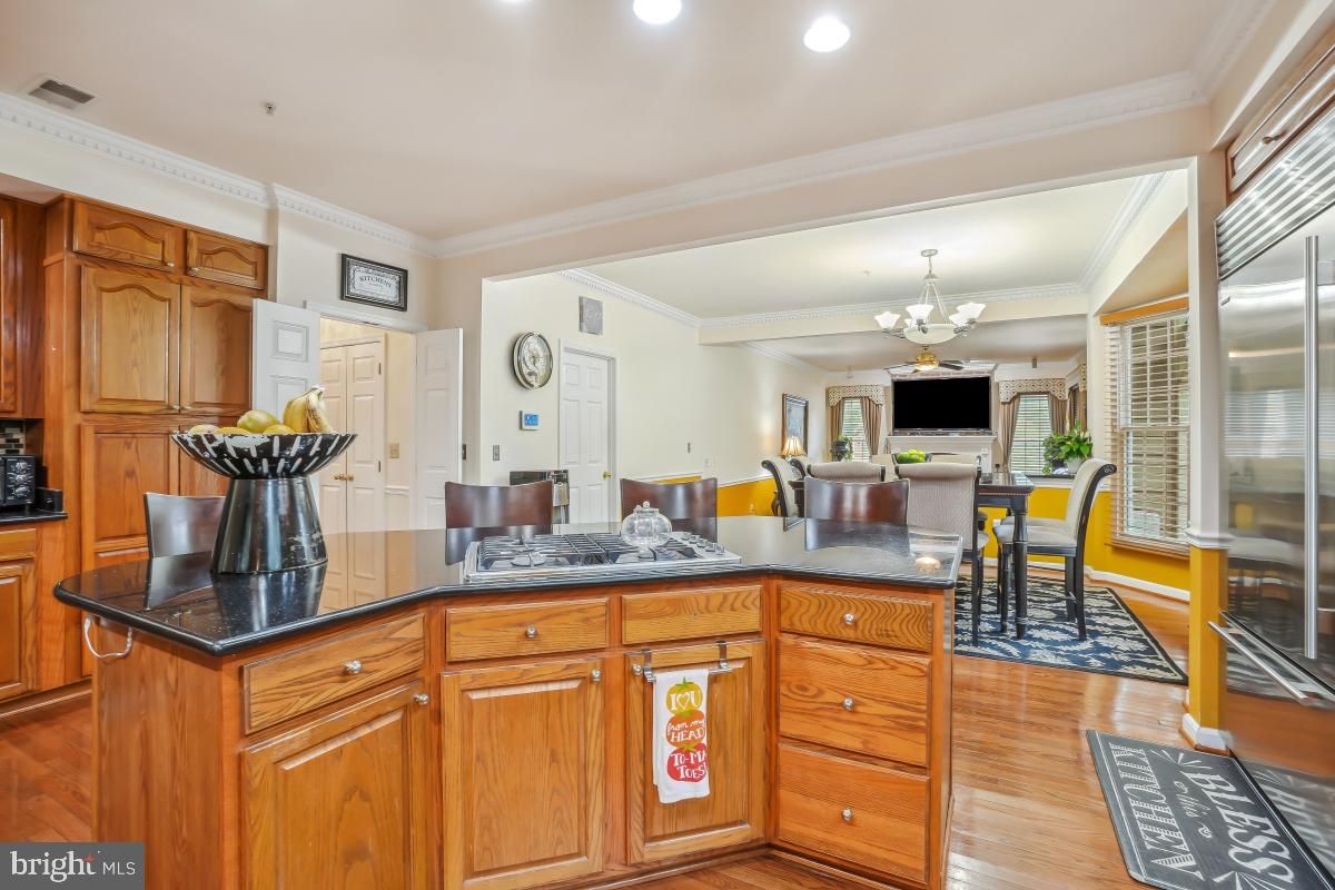 Chandelier, Dining room, Interior, Kitchen, Recessed Lighting, Stainless Steel Appliances, Wood Texture Flooring