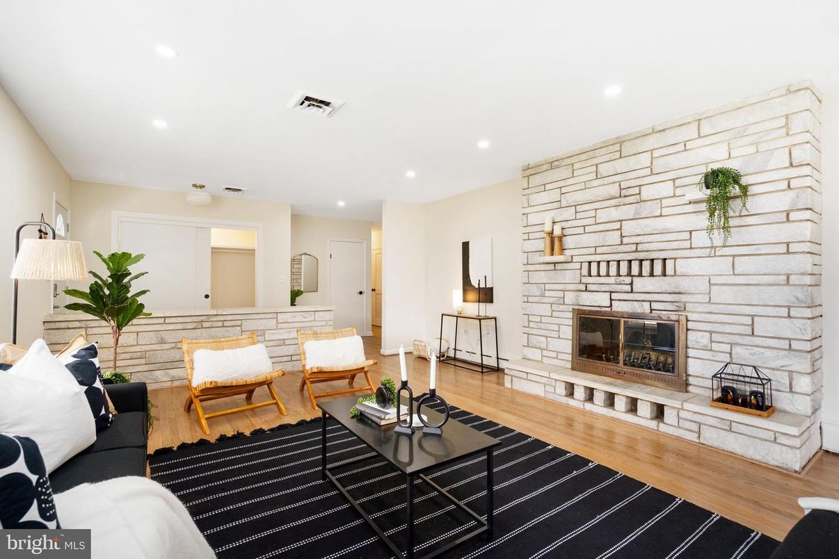 Fireplace, Interior, Living room, Recessed Lighting, Stone Walls, Wood Texture Flooring