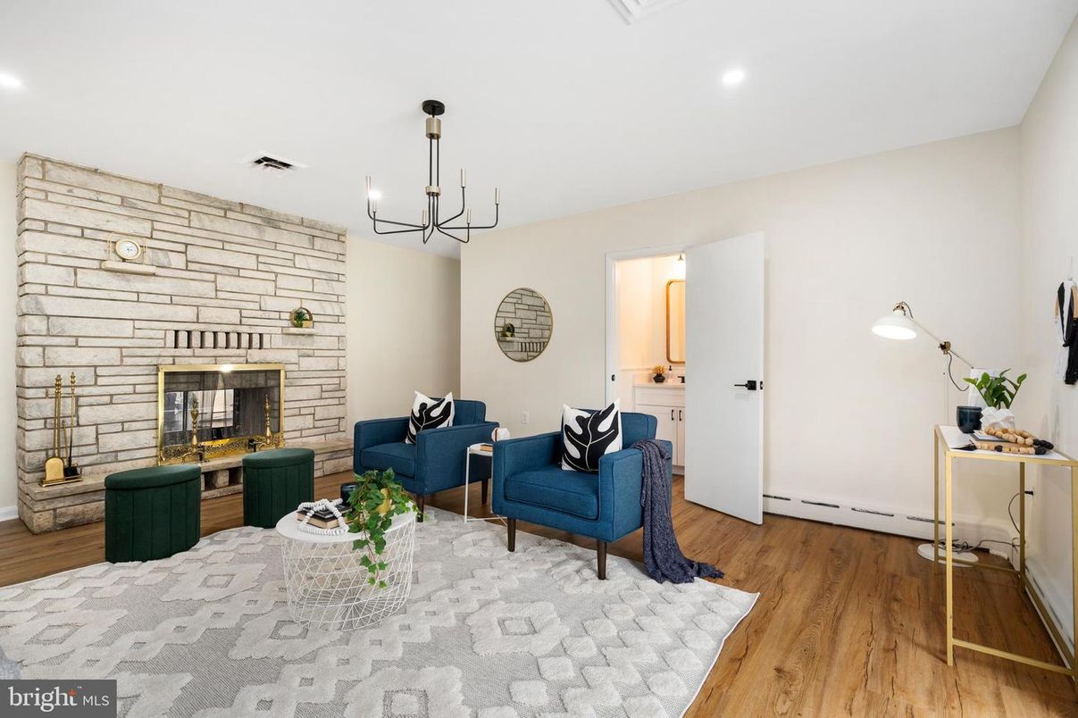 Chandelier, Fireplace, Interior, Living room, Recessed Lighting, Stone Walls, Wood Texture Flooring