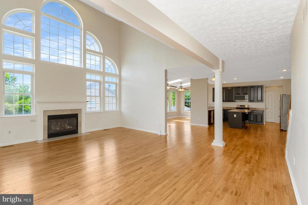 Empty room, Fireplace, Interior, Kitchen, Recessed Lighting, Wood Texture Flooring