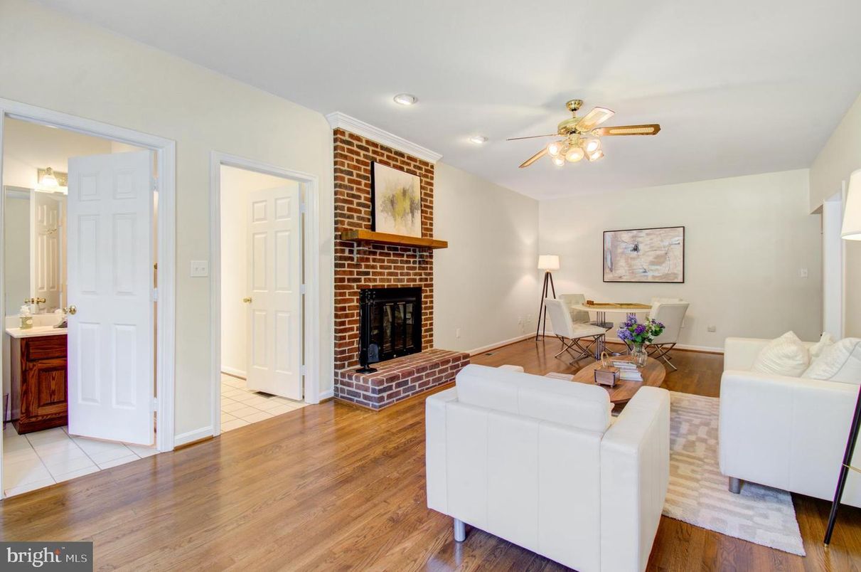 Dining room, Fireplace, Interior, Living room, Recessed Lighting, Stone Walls, Wood Texture Flooring