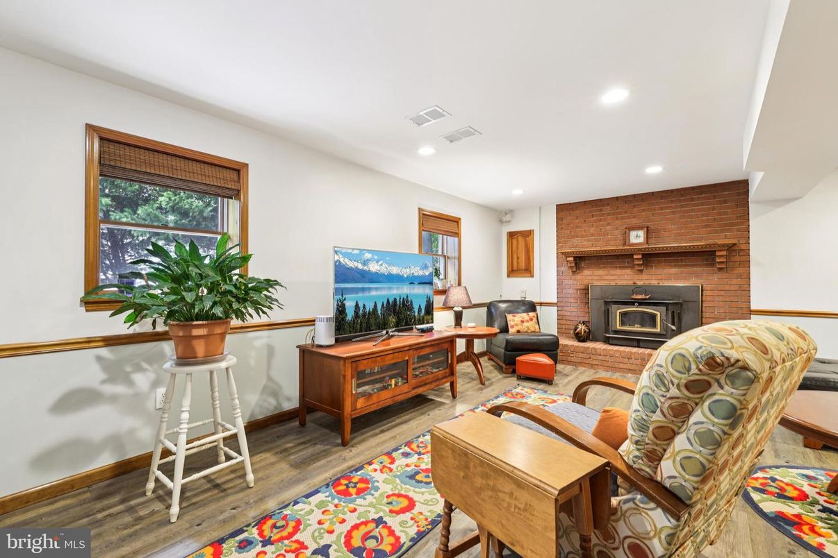 Fireplace, Interior, Living room, Recessed Lighting, Stone Walls, Wood Texture Flooring