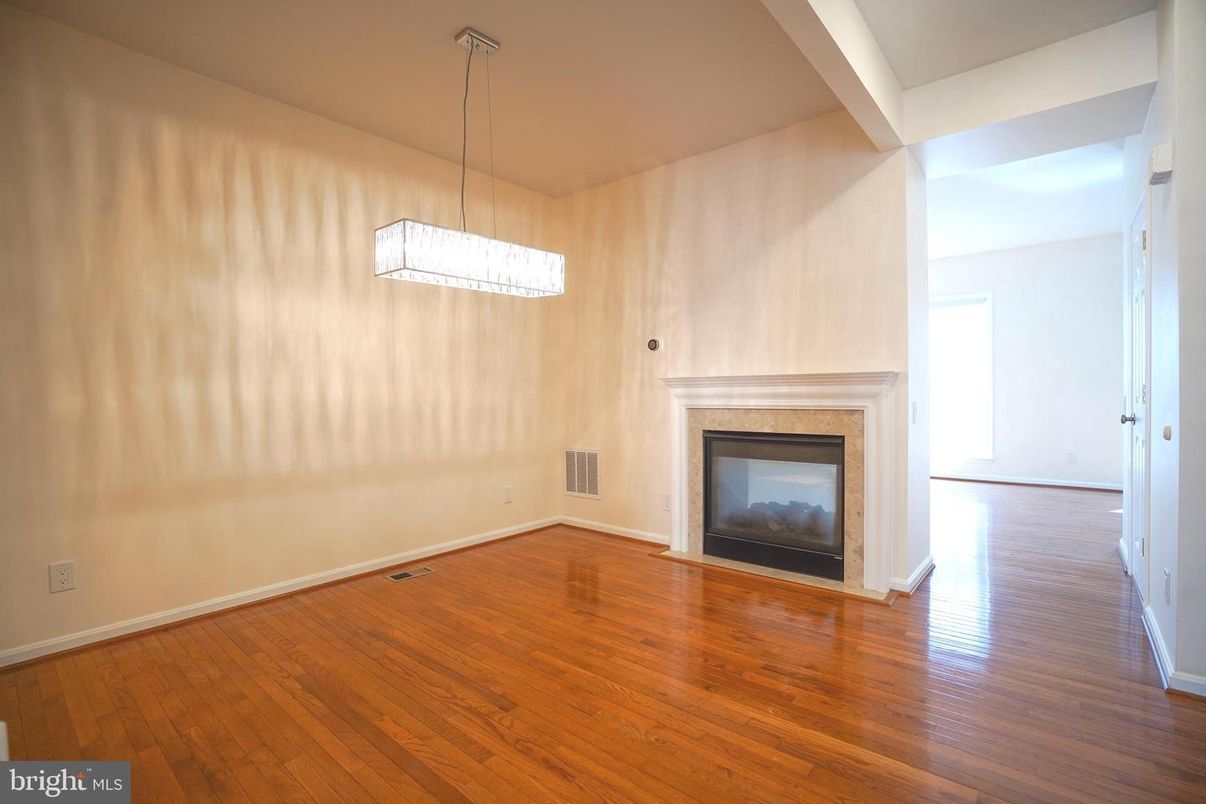 Empty room, Fireplace, Interior, Pendant Lights, Wood Texture Flooring