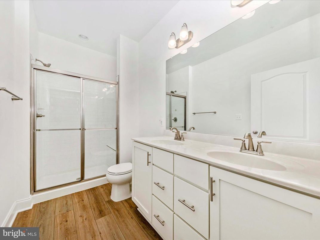 Bathroom, Dual Sink Vanities, Glass Shower, Interior, Wood Texture Flooring