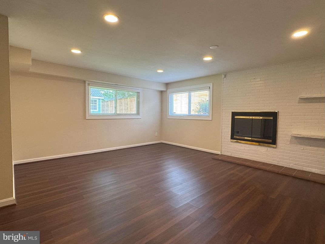 Empty room, Fireplace, Interior, Recessed Lighting, Stone Walls, Wood Texture Flooring