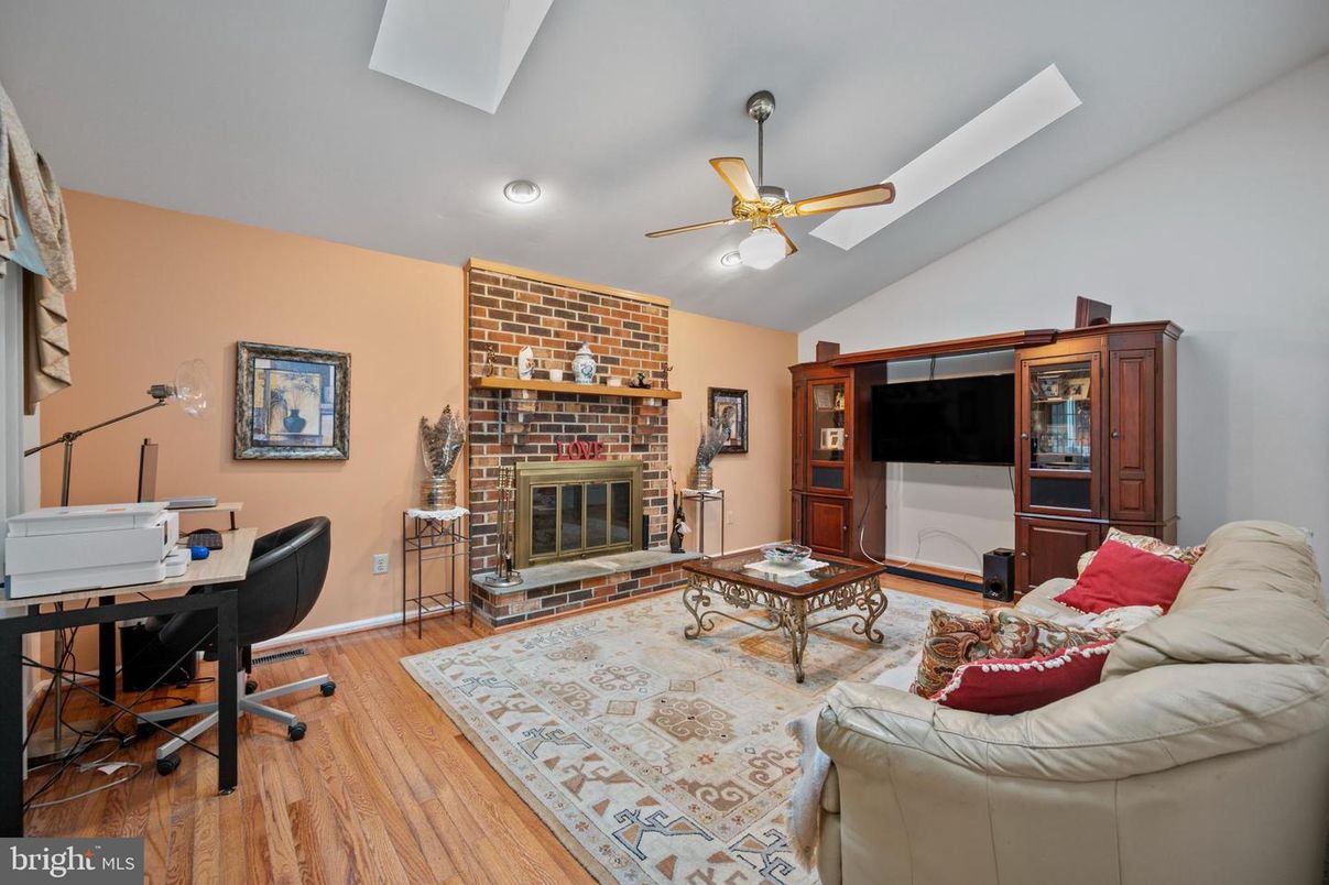 Fireplace, Home Office, Interior, Living room, Recessed Lighting, Stone Walls, Wood Texture Flooring