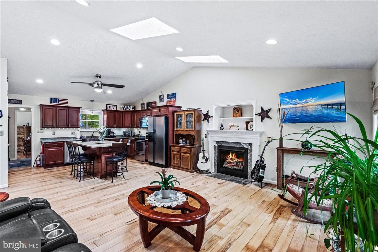Dining room, Fireplace, Interior, Kitchen, Recessed Lighting, Wood Texture Flooring