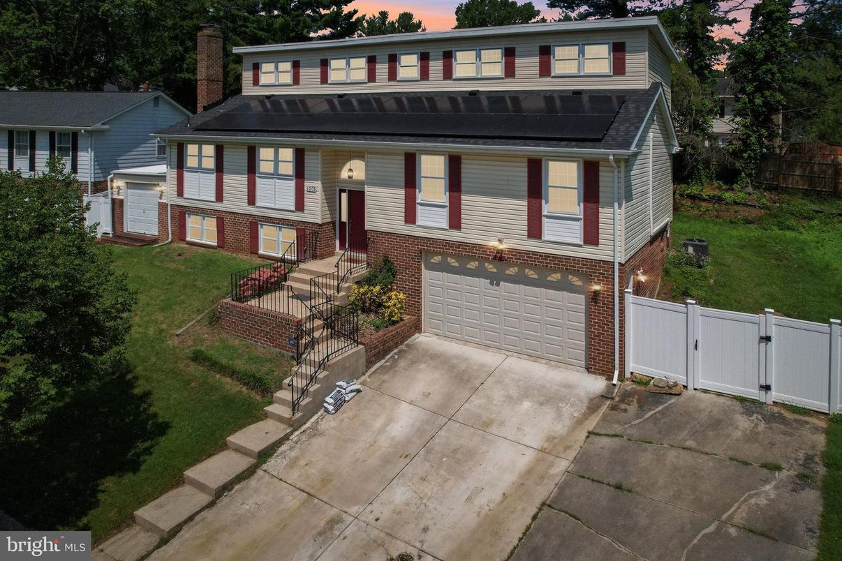 Attached, Exterior, Facade, Brick Facade, Solar Panels, Raised Ranch