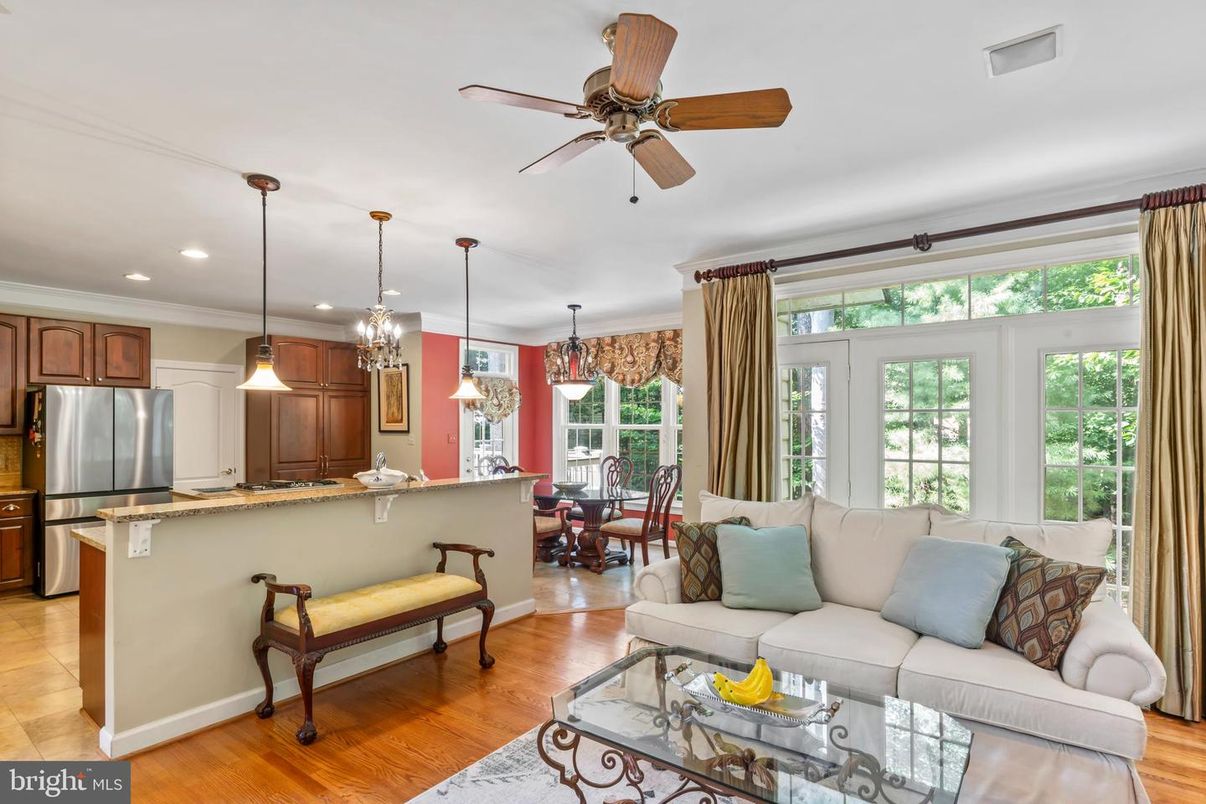 Chandelier, Dining room, Interior, Kitchen, Living room, Pendant Lights, Recessed Lighting, Stainless Steel Appliances, Wood Texture Flooring