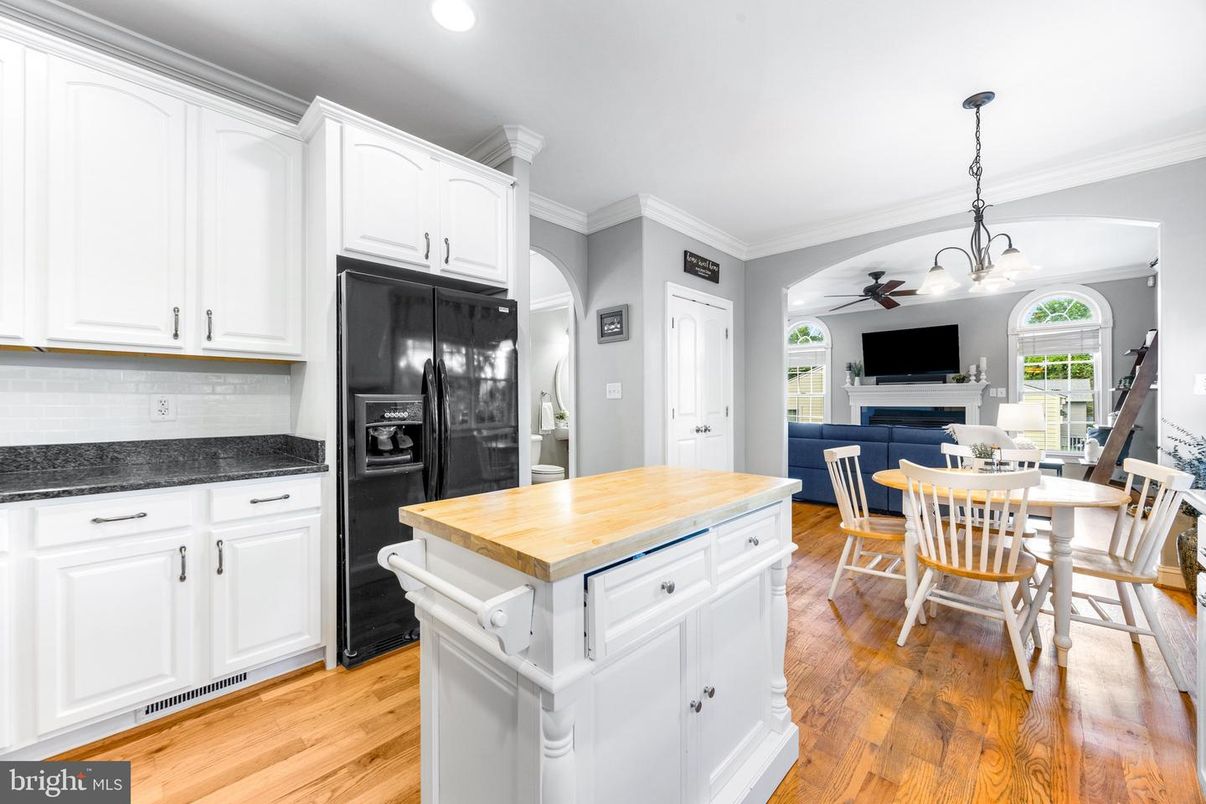Dining room, Fireplace, Interior, Kitchen, Pendant Lights, Recessed Lighting, Wood Texture Flooring