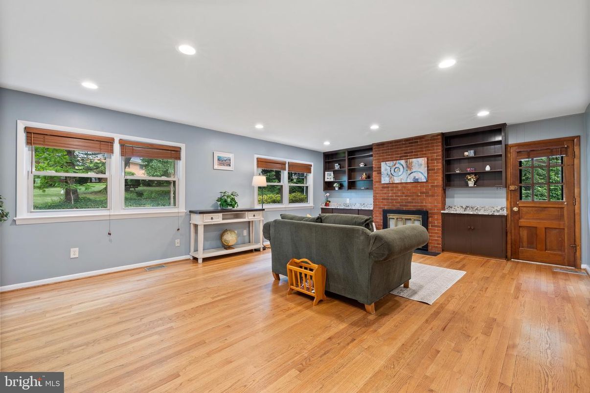 Fireplace, Interior, Living room, Recessed Lighting, Stone Walls, Wood Texture Flooring