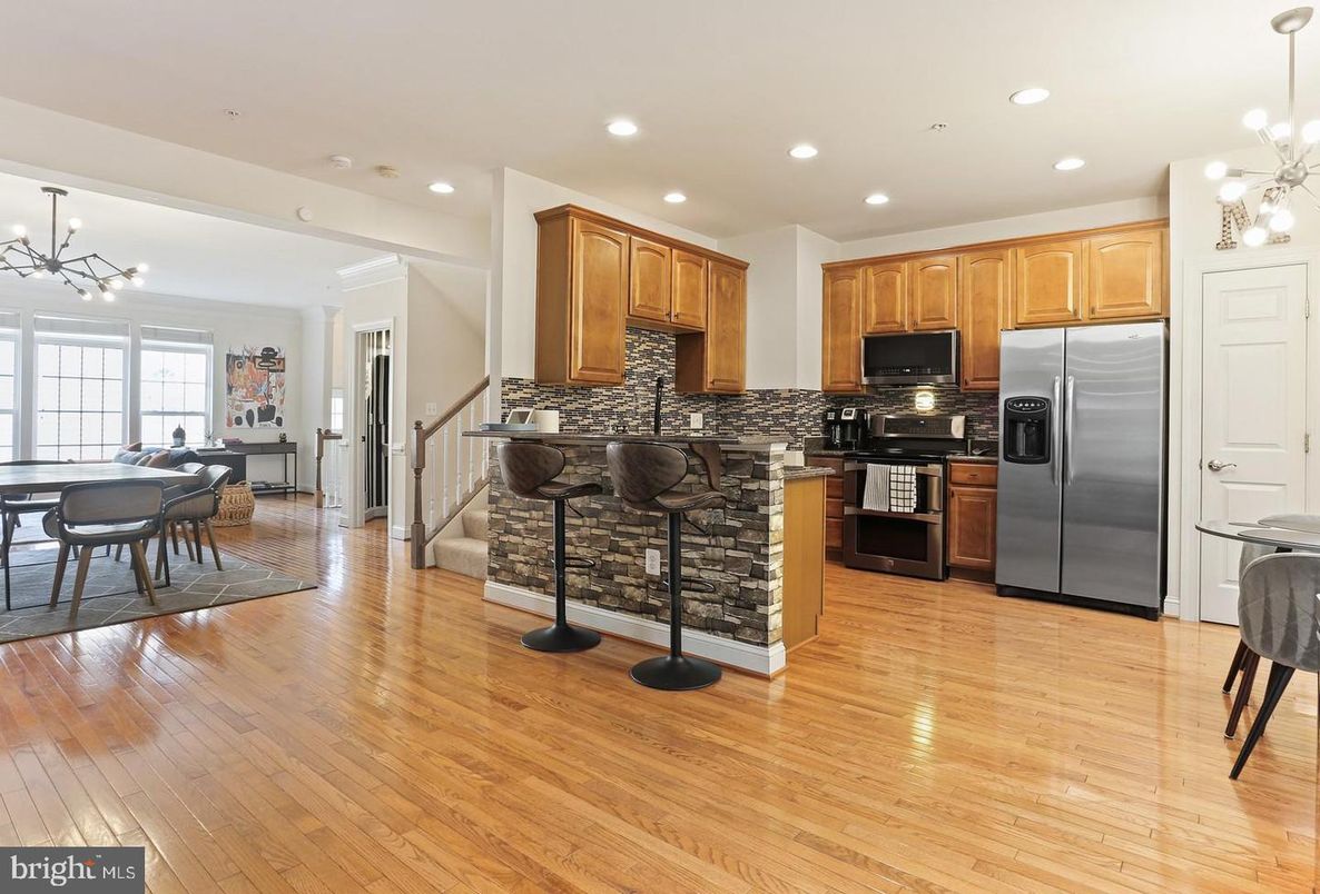 Chandelier, Dining room, Interior, Kitchen, Pendant Lights, Recessed Lighting, Stainless Steel Appliances, Wood Texture Flooring