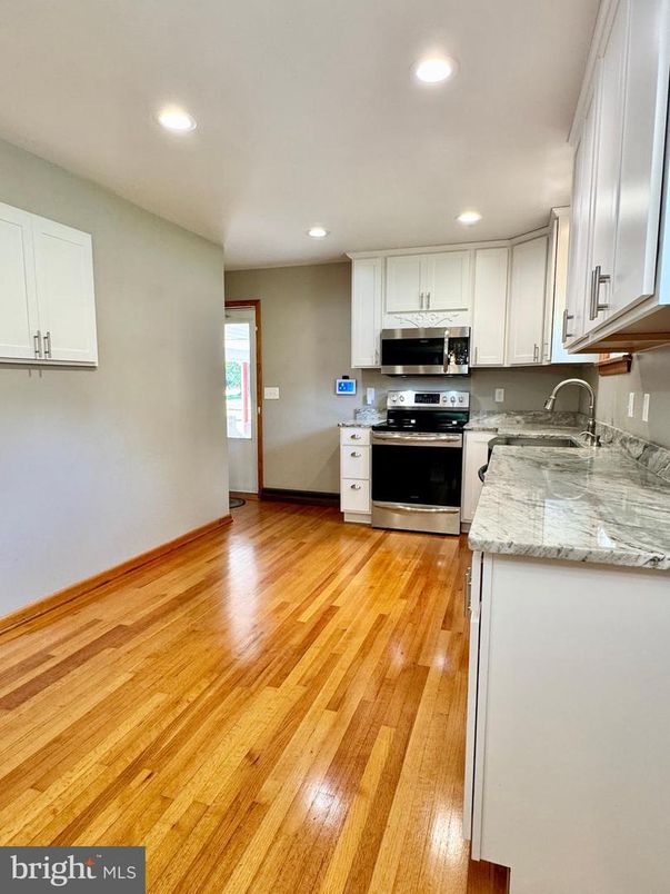 Interior, Kitchen, Recessed Lighting, Stainless Steel Appliances, Wood Texture Flooring