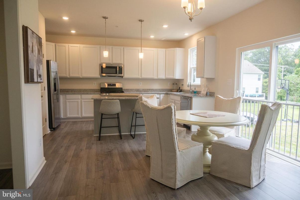 Dining room, Interior, Kitchen, Pendant Lights, Recessed Lighting, Stainless Steel Appliances, Wood Texture Flooring