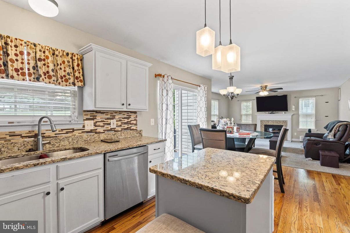 Chandelier, Dining room, Fireplace, Interior, Kitchen, Pendant Lights, Wood Texture Flooring
