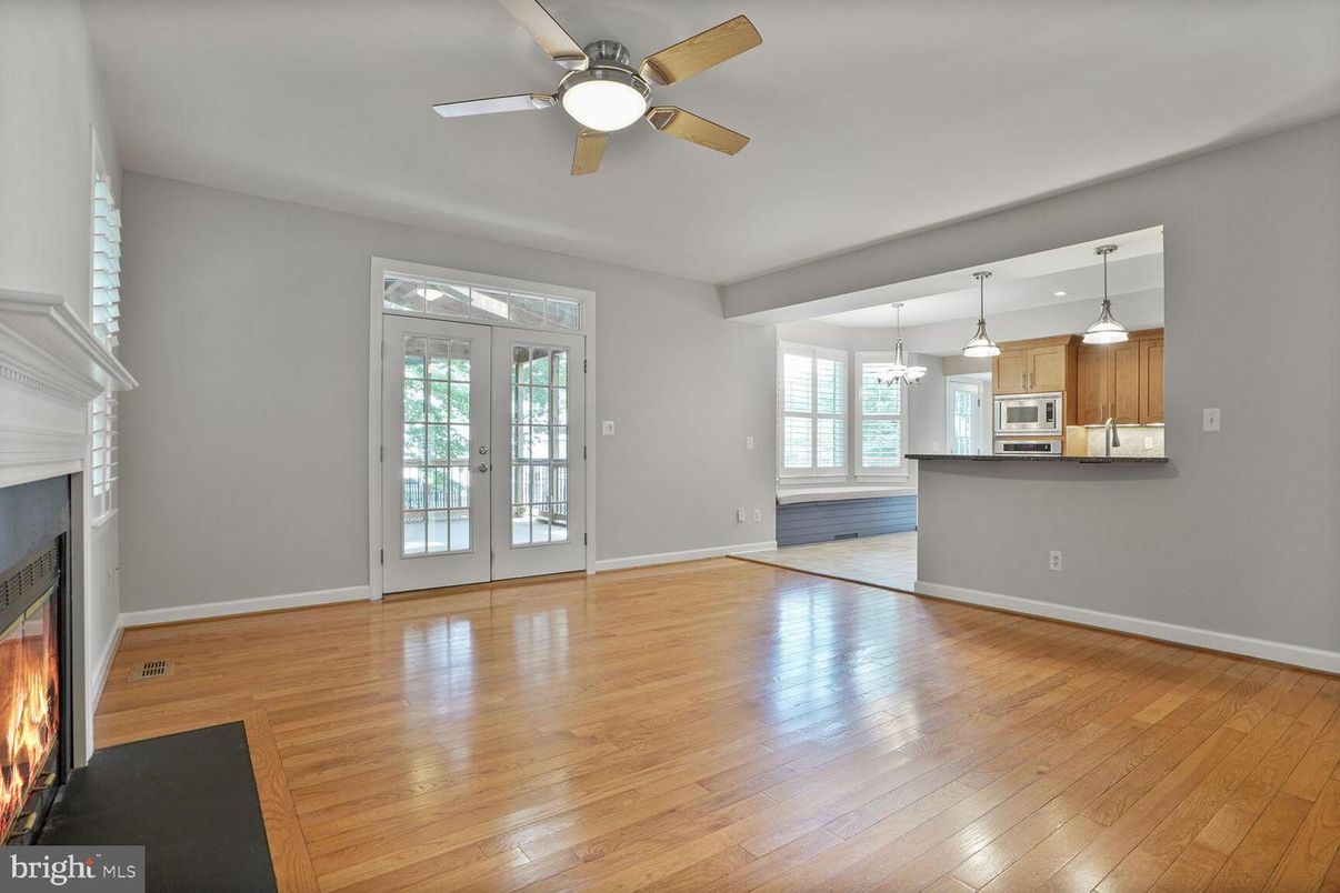 Empty room, Fireplace, Interior, Kitchen, Pendant Lights, Wood Texture Flooring