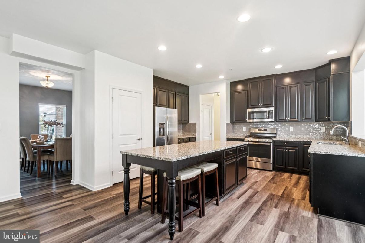 Dining room, Interior, Kitchen, Recessed Lighting, Stainless Steel Appliances, Wood Texture Flooring