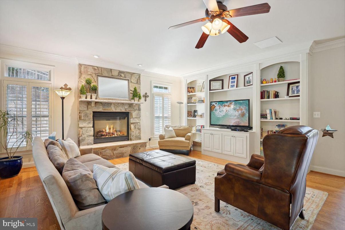 Fireplace, Interior, Living room, Recessed Lighting, Stone Walls, Wood Texture Flooring