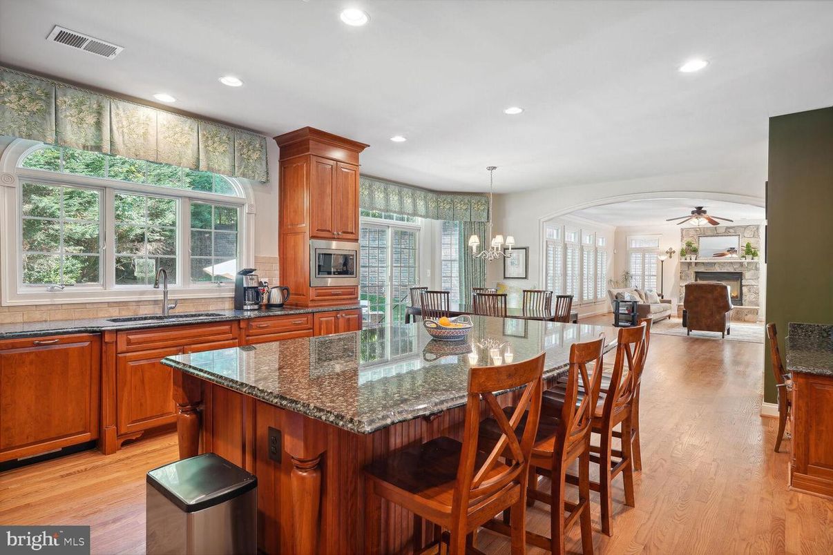Chandelier, Dining room, Fireplace, Interior, Kitchen, Recessed Lighting, Stainless Steel Appliances, Wood Texture Flooring