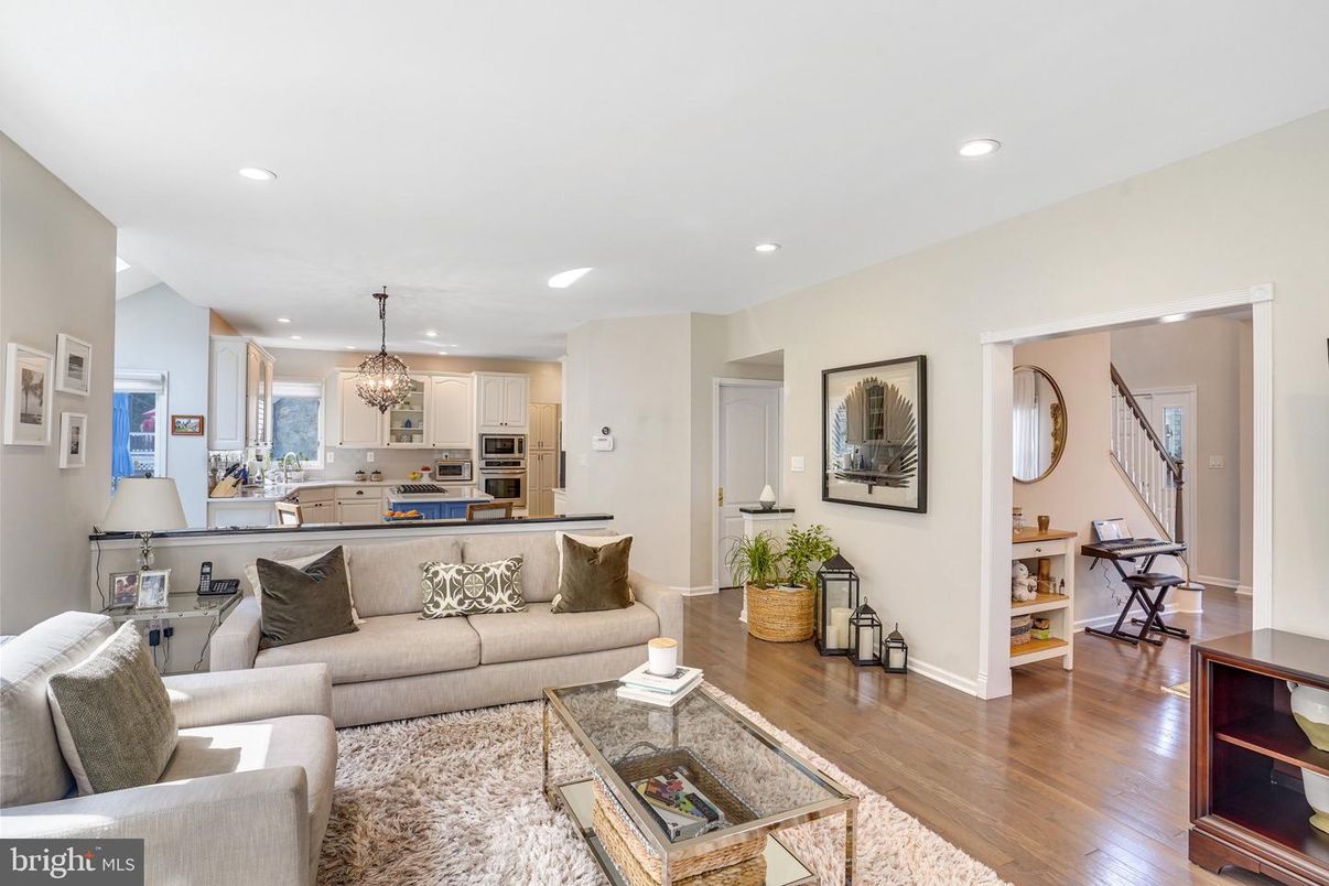 Chandelier, Interior, Kitchen, Living room, Pendant Lights, Recessed Lighting, Stainless Steel Appliances, Wood Texture Flooring