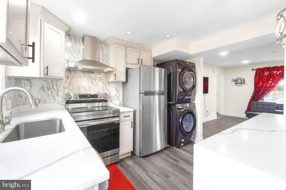 Interior, Kitchen, Marble Walls, Recessed Lighting, Stainless Steel Appliances, Wood Texture Flooring