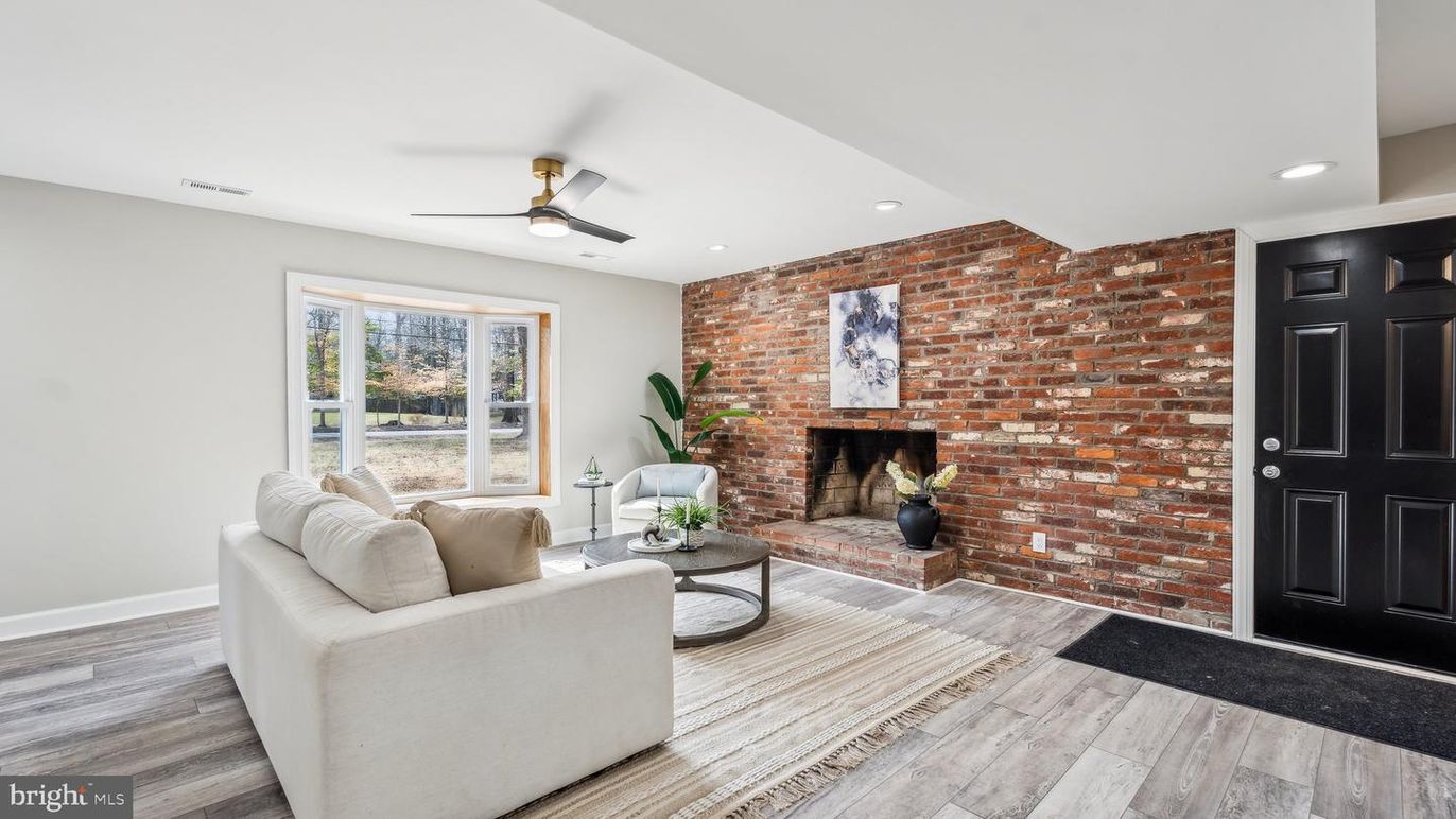 Fireplace, Interior, Living room, Recessed Lighting, Stone Walls, Wood Texture Flooring
