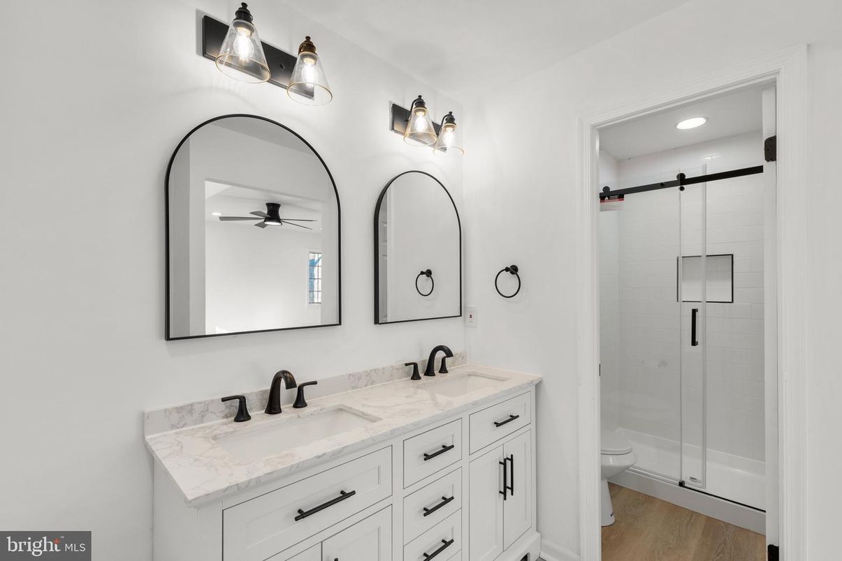 Bathroom, Dual Sink Vanities, Glass Shower, Interior, Recessed Lighting, Wood Texture Flooring
