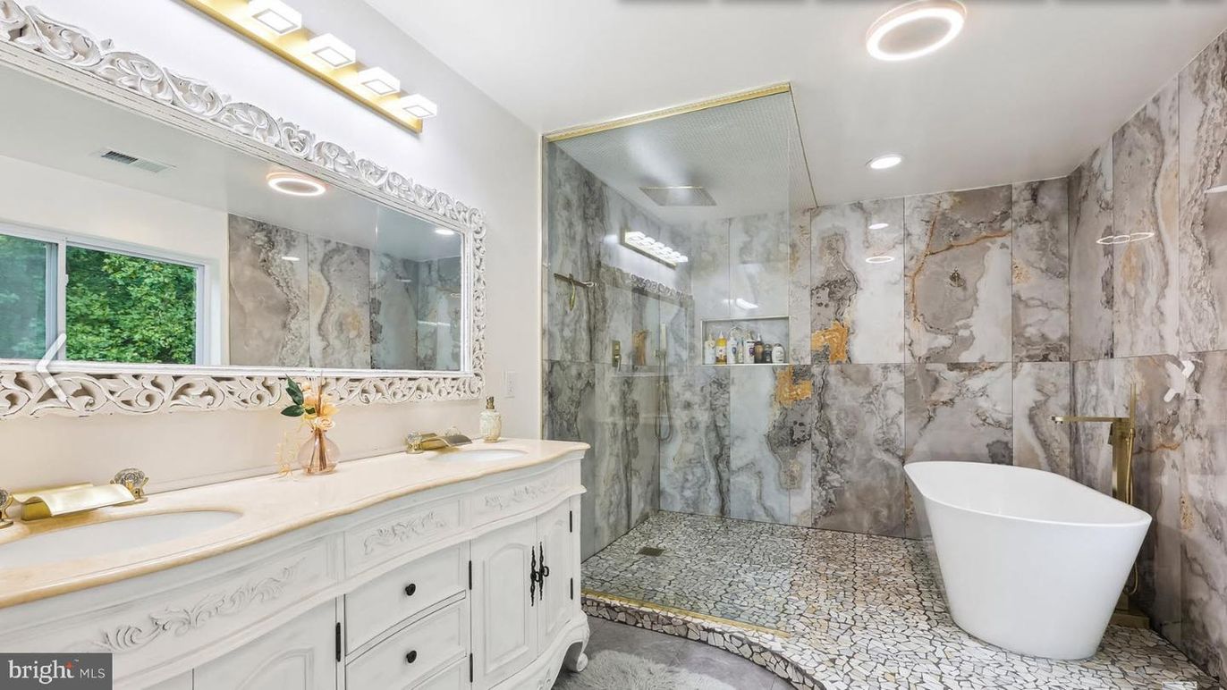 Bathroom, Dual Sink Vanities, Free Standing Baths, Glass Shower, Interior, Marble Walls, Recessed Lighting
