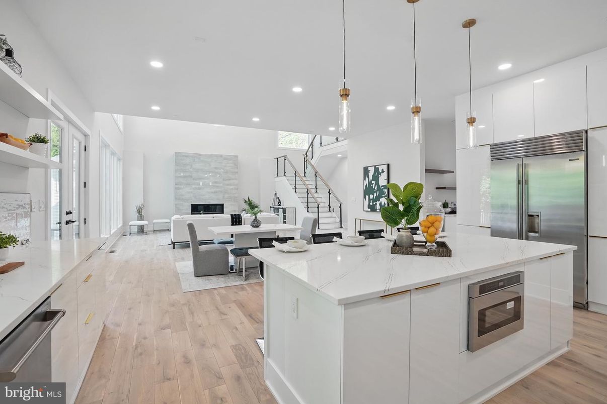 Dining room, Fireplace, Interior, Kitchen, Living room, Pendant Lights, Recessed Lighting, Stainless Steel Appliances, Wood Texture Flooring