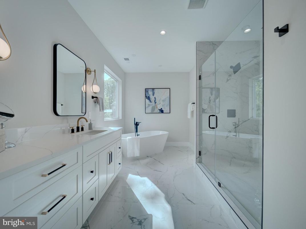 Bathroom, Dual Sink Vanities, Free Standing Baths, Glass Shower, Interior, Marble, Marble Walls, Recessed Lighting