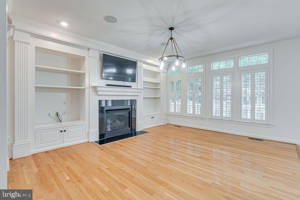 Empty room, Fireplace, Interior, Pendant Lights, Recessed Lighting, Wood Texture Flooring