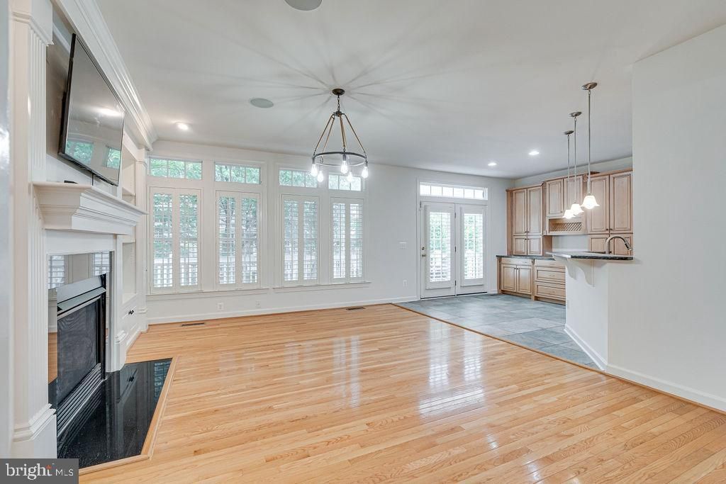 Empty room, Fireplace, Interior, Kitchen, Pendant Lights, Recessed Lighting, Wood Texture Flooring