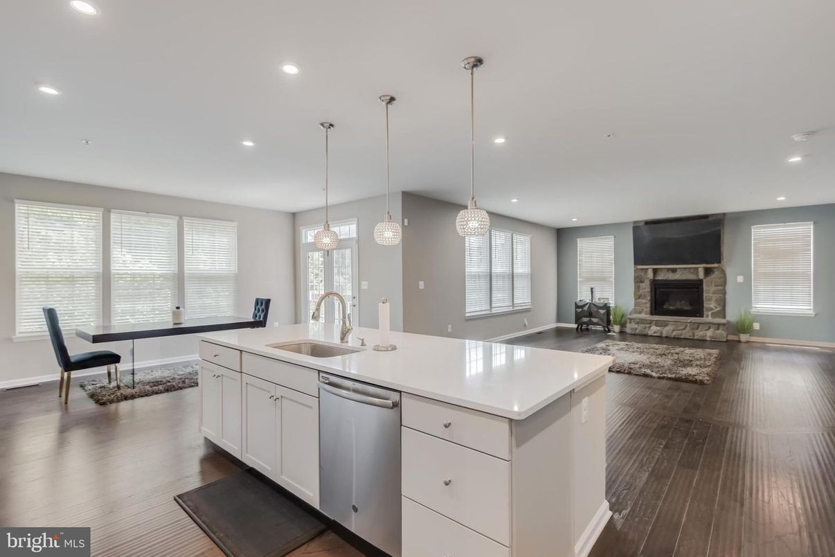Dining room, Fireplace, Interior, Kitchen, Pendant Lights, Recessed Lighting, Stainless Steel Appliances, Wood Texture Flooring
