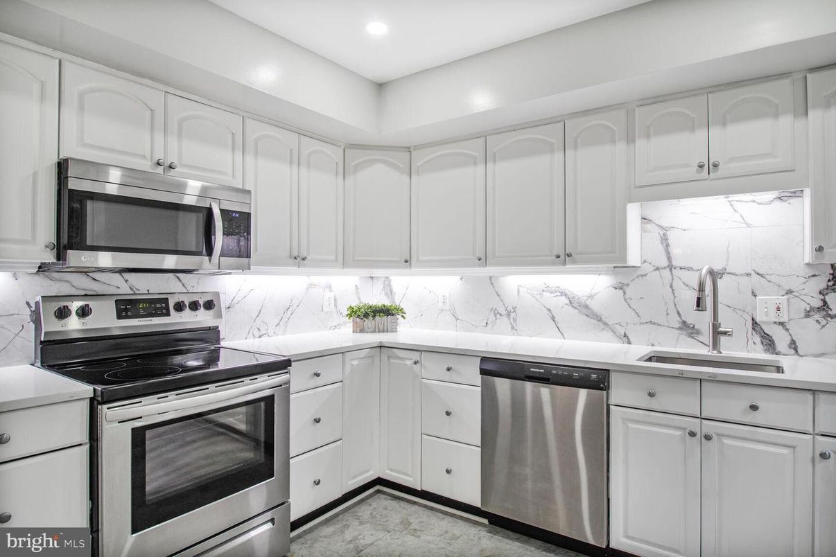 Interior, Kitchen, Marble Walls, Recessed Lighting, Stainless Steel Appliances