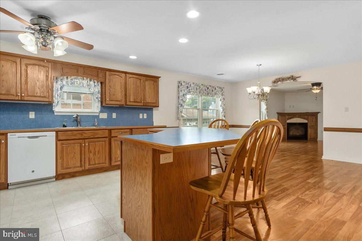 Chandelier, Dining room, Fireplace, Interior, Kitchen, Recessed Lighting, Wood Texture Flooring